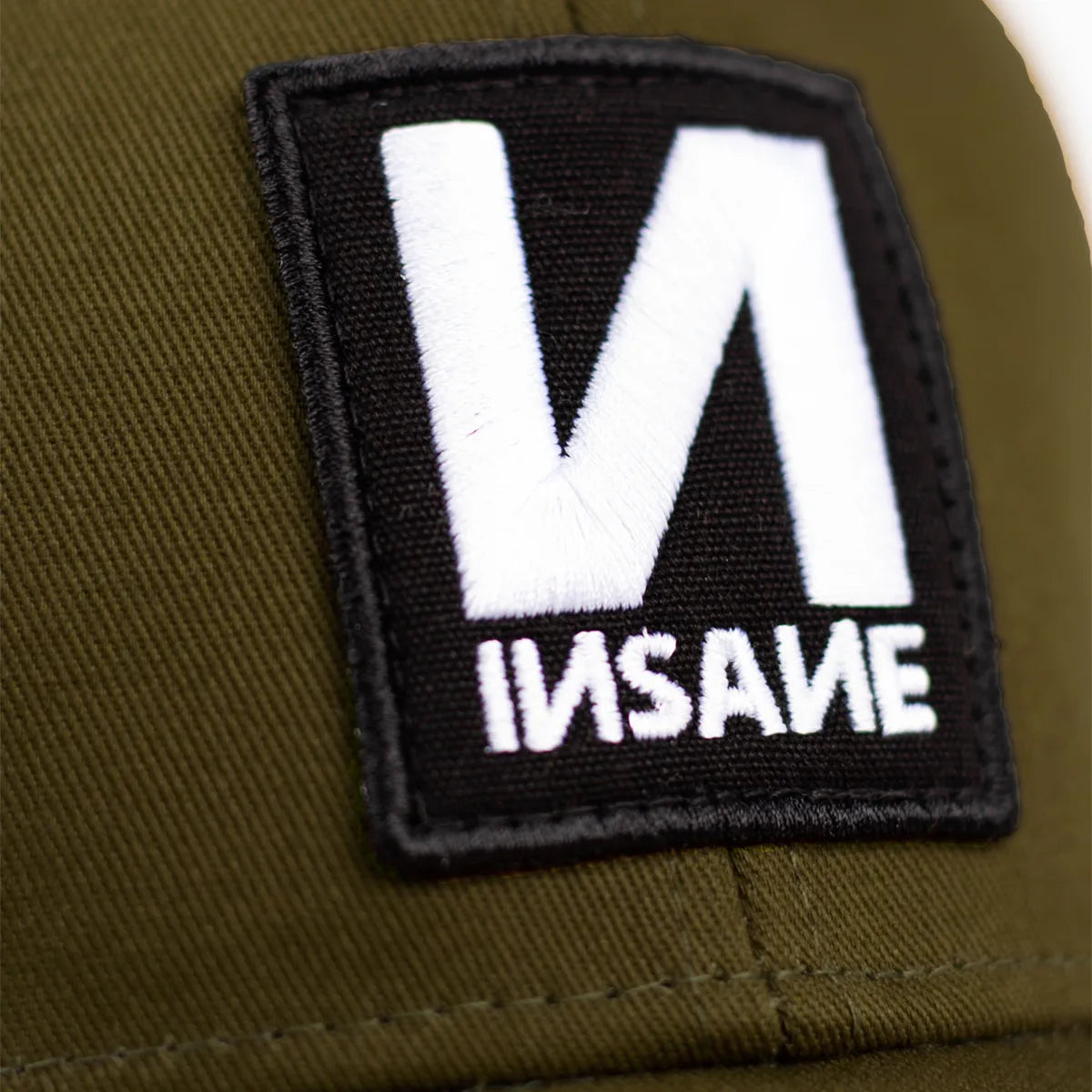 KHAKI BASEBALL CAP WITH "И" PATCH.